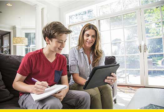 Mother helps her child with homework